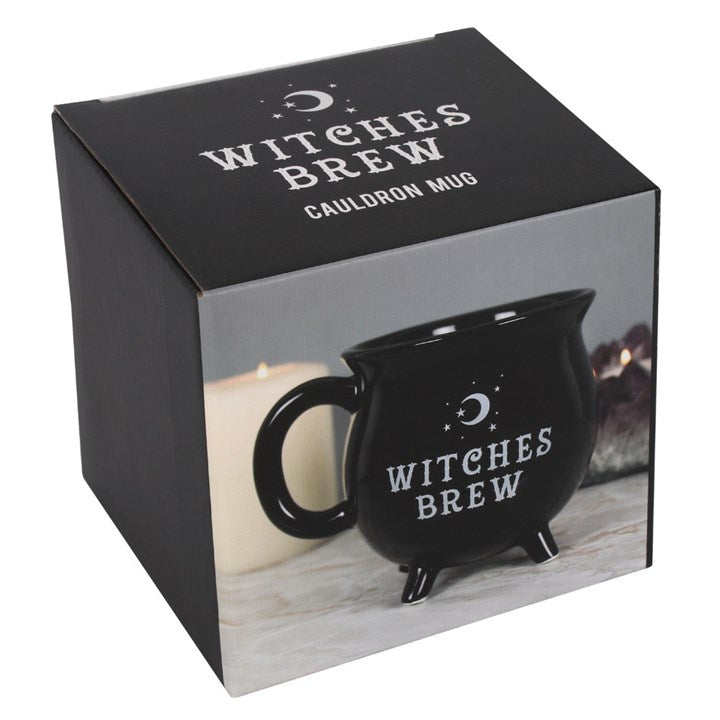 Black 'Witches Brew' cauldron mug in packaging with text on a white background